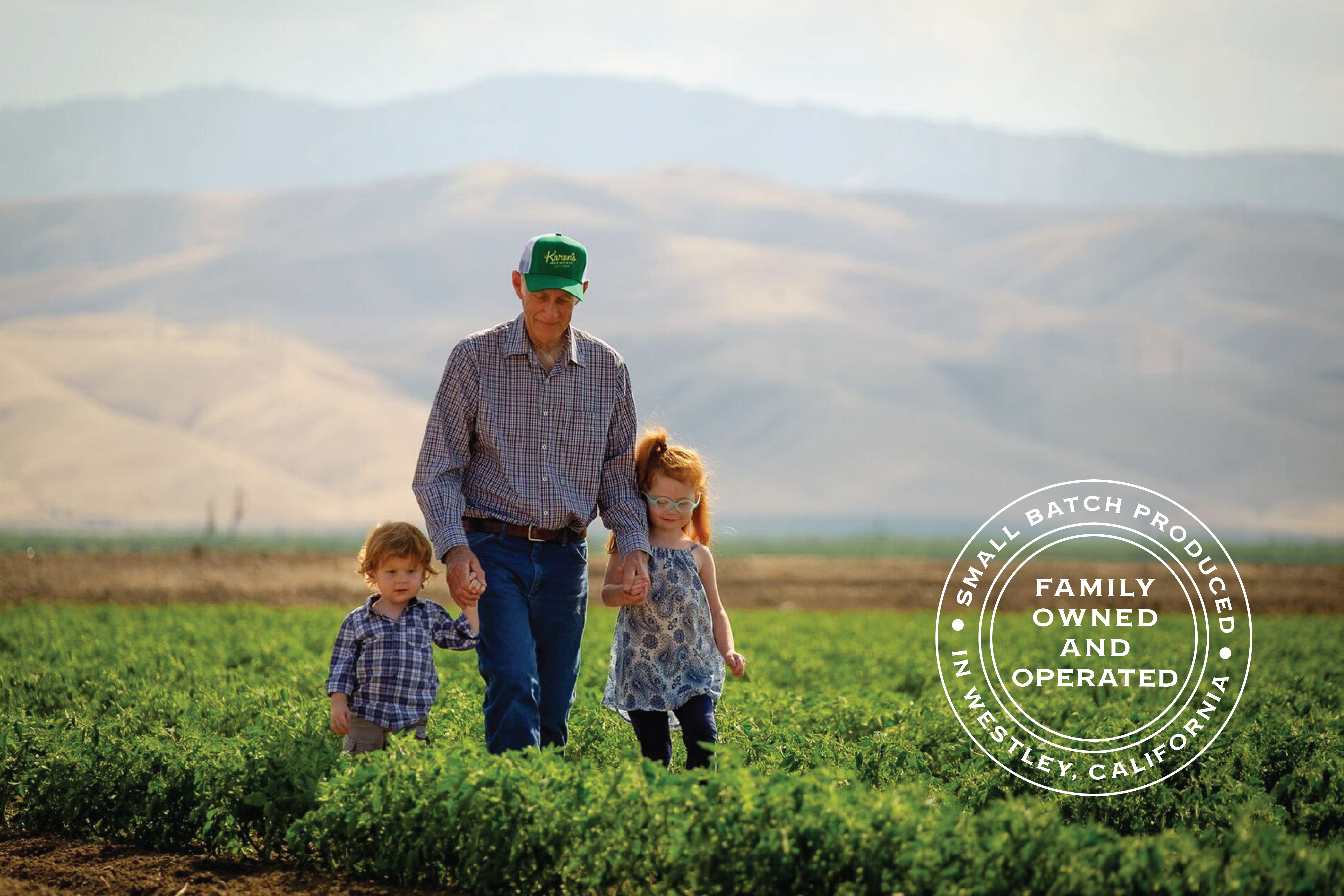 Farmer Bill, the patriarch of Karen's Natuals, with his grandkids walking in the field or crops. 